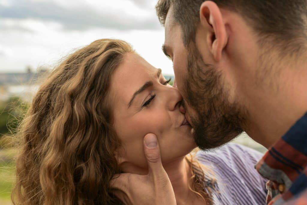 couple kissing on beach