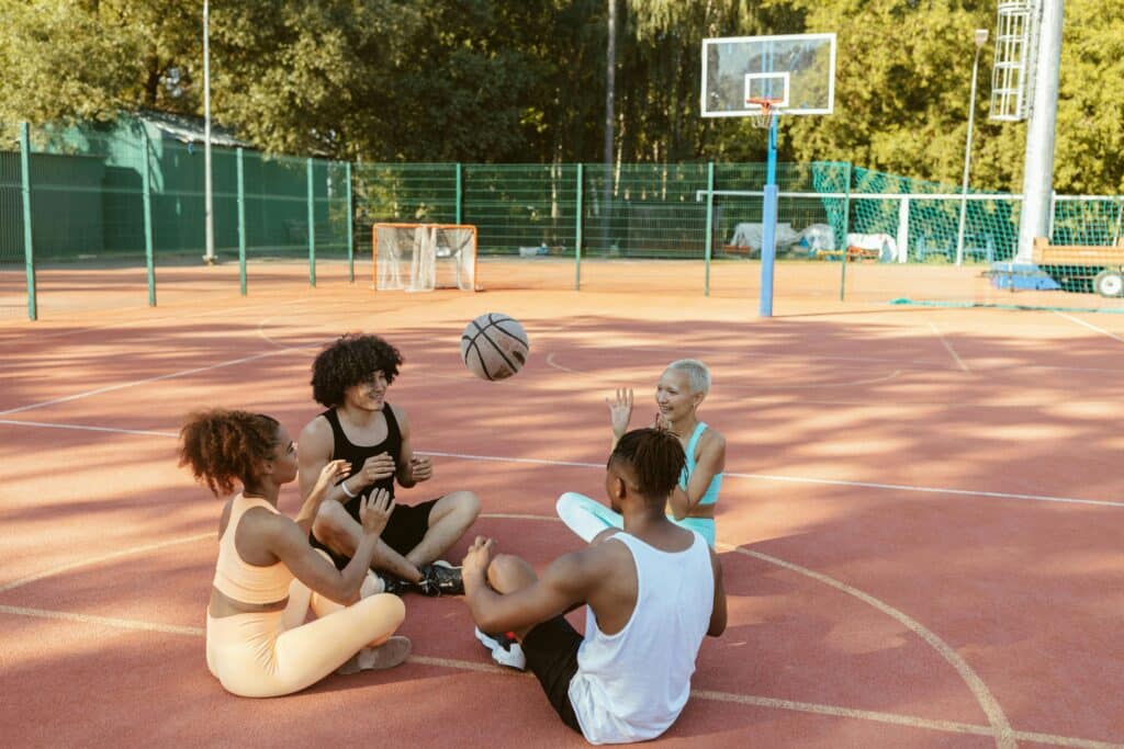 people playing basketball together