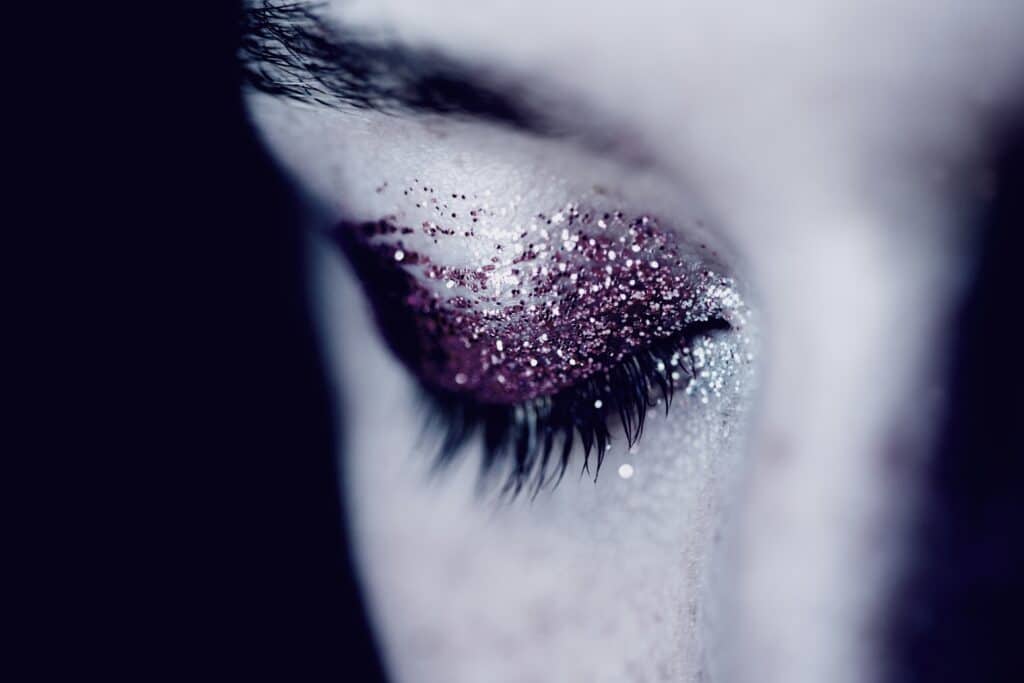 woman's eyes close after abuse