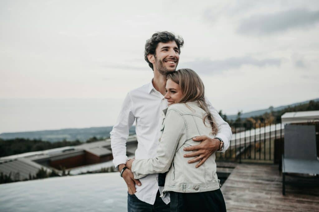 wife and husband smiling
