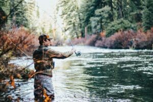 man fishing in river