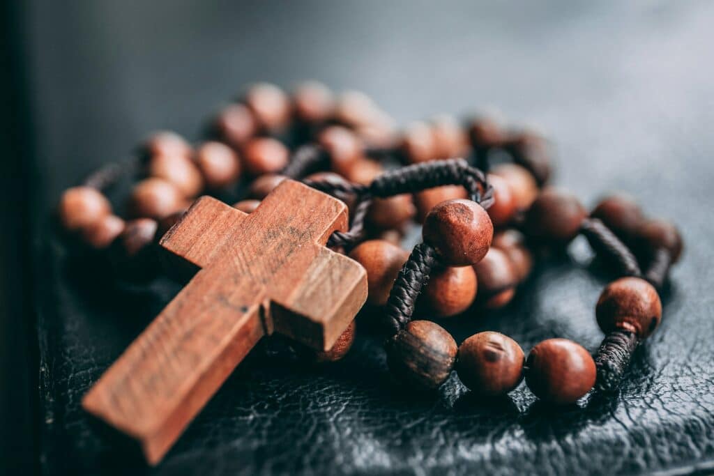 cross necklace on table