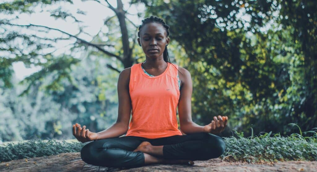 woman meditating outside