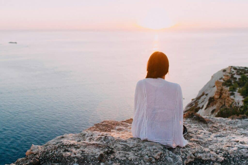 woman looking over the ocean