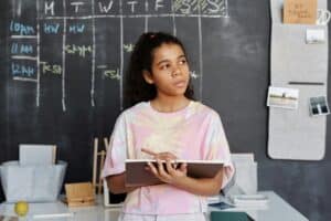 young lady in class thinking