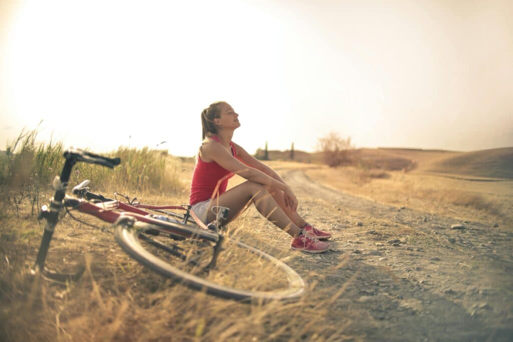 woman riding bike and taking a break