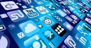 Blue digital collage of social media icons arranged in a grid, including YouTube, Reddit, Facebook, Twitter, and LinkedIn.